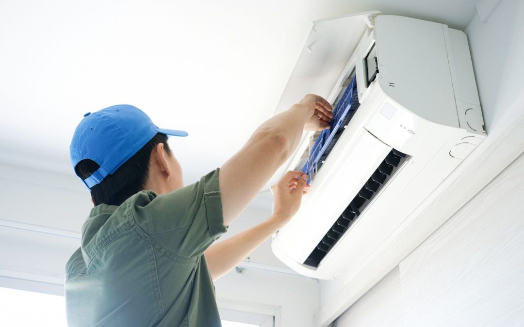 HVAC technician servicing a ductless mini split in Seal Beach