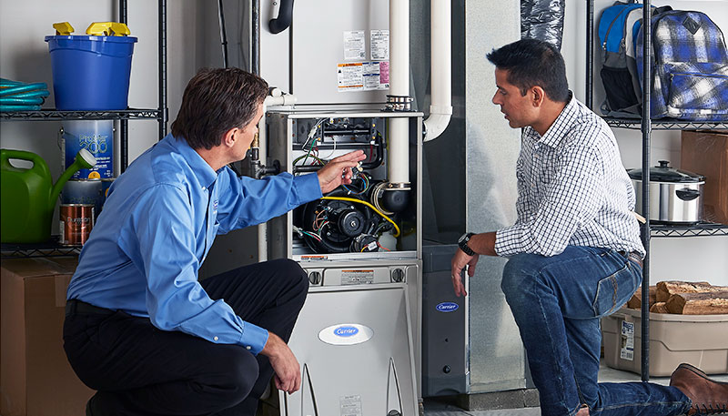 Technician evaluating a furnace for repair or replacement in Seal Beach