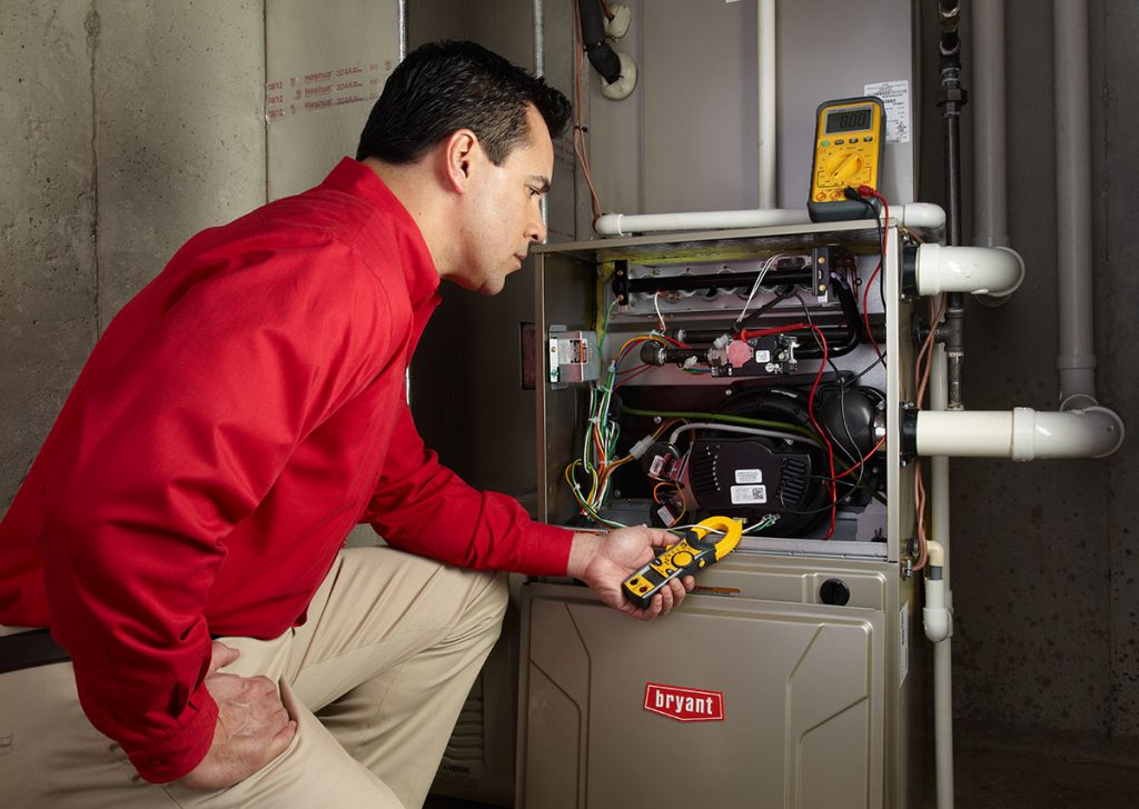 Heating technician diagnosing a furnace repair in Seal Beach