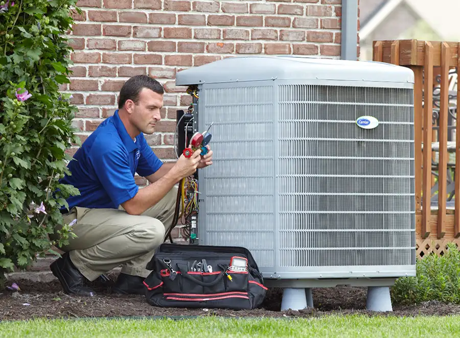 HVAC technician inspecting an outdoor AC unit in Seal Beach